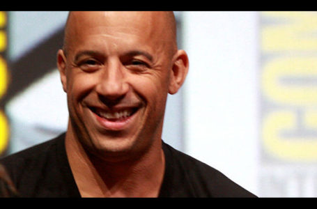 Vin Diesel speaking at the 2013 San Diego Comic Con International, for “Riddick”, at the San Diego Convention Center in San Diego, California. Photo by Gage Skidmore (Vin DieselUploaded by Dudek1337) [CC BY-SA 2.0], via Wikimedia Commons.