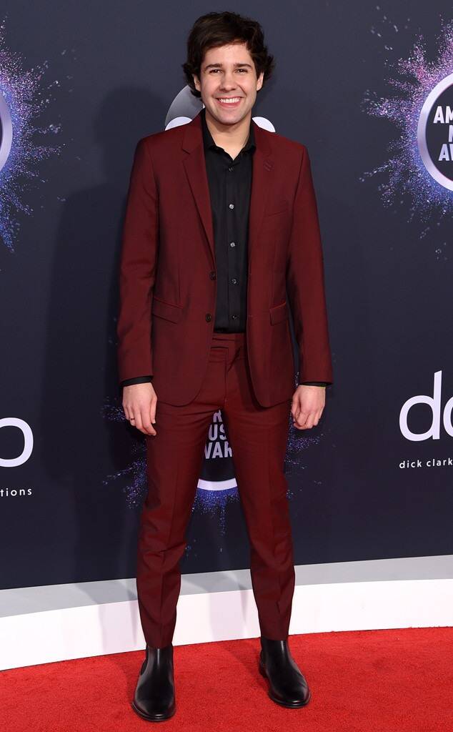 David Dobrik wearing red suit at the American Music Awards [Credit: Stewart Cook/Shutterstock]