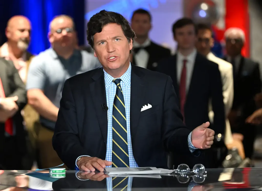 Tucker Carlson is seen during a Fox News broadcast in 2022. Carlson's attorney spoke out about his client's recent firing on Sunday, insisting that Fox News is "not going to silence" Carlson moving forward. (Credits: JASON KOERNER/GETTY IMAGES)